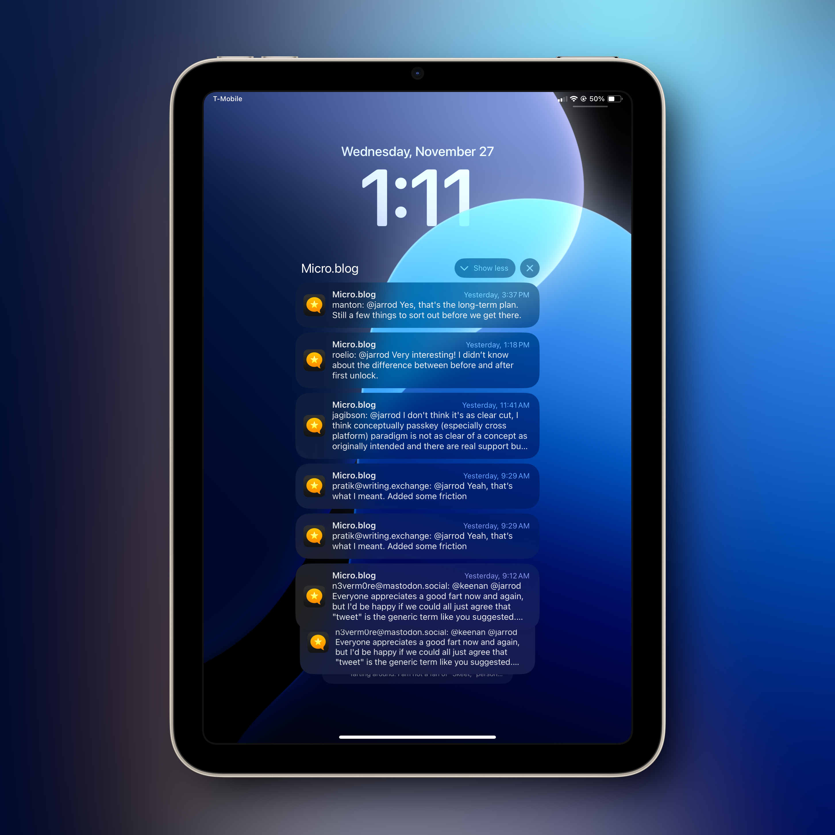 Auto-generated description: A tablet screen displays notifications from a micro blog app with the time showing as 1:11 on Wednesday, November 27.