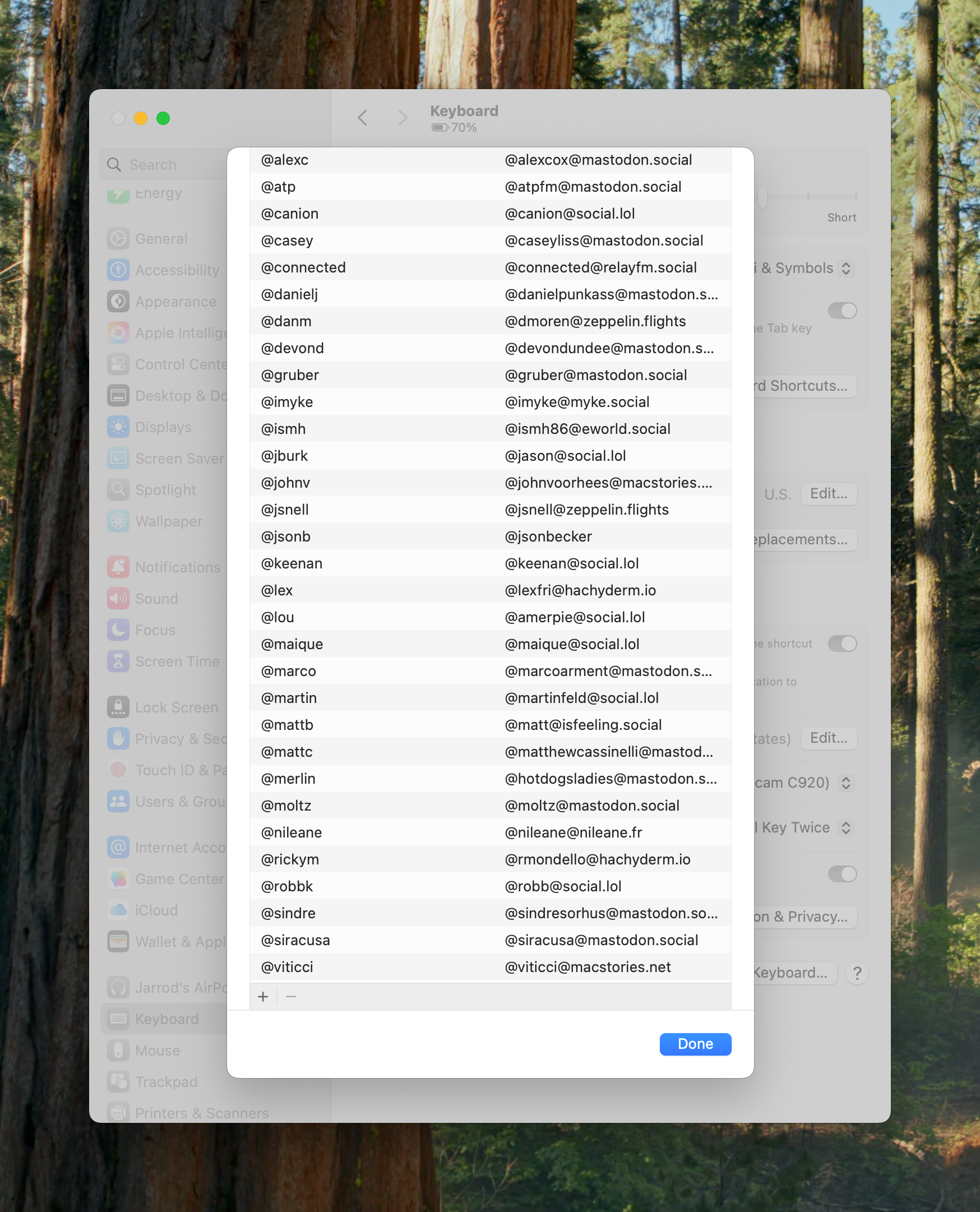 A pop-up window lists usernames and their mastodon addresses. The content is overlaid on a settings menu with options like "General" and "Keyboard" visible in a forest-themed background.